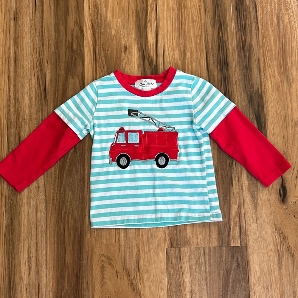 Size XS (fits like 18/24 months) great condition. Cotton material